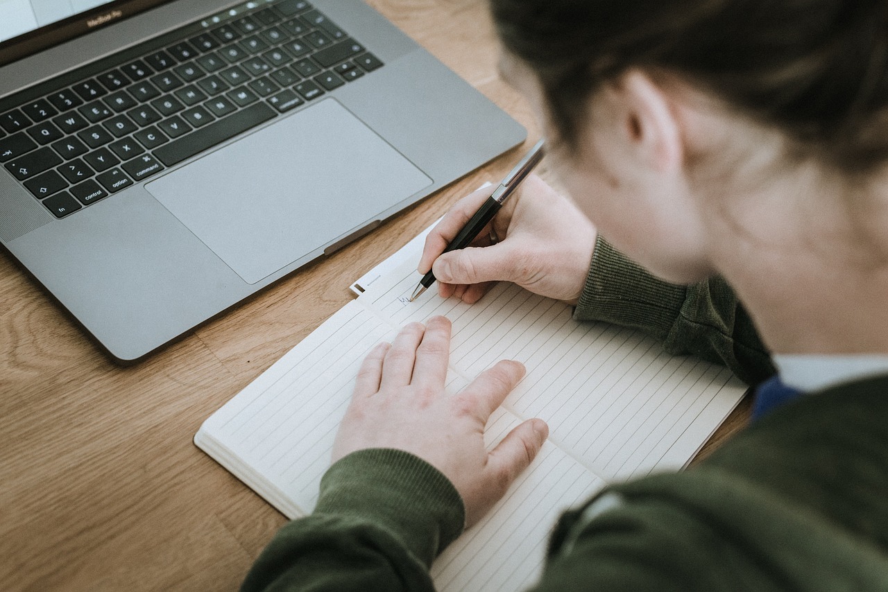 Girl writing on a paper